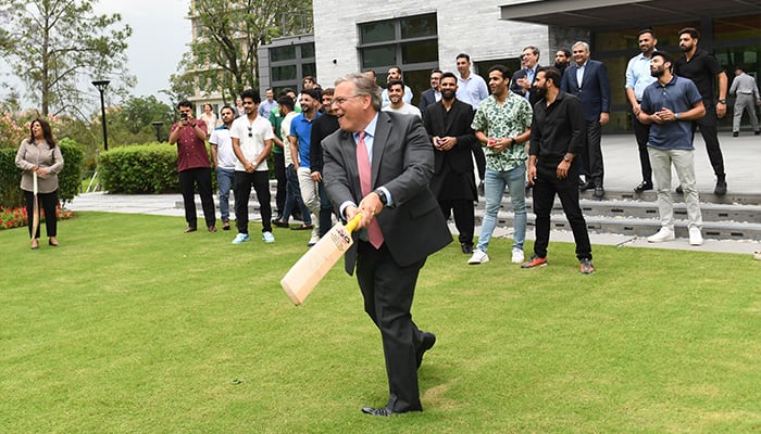 US Ambassador Donald Blome enjoying cricket with Pakistan team players at US Embassy in this undated photo. — X/@usembislamabad